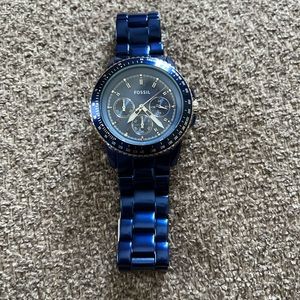 Women’s blue large face Fossil watch.